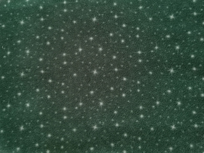 Tela polar (fleece) verde estrellas